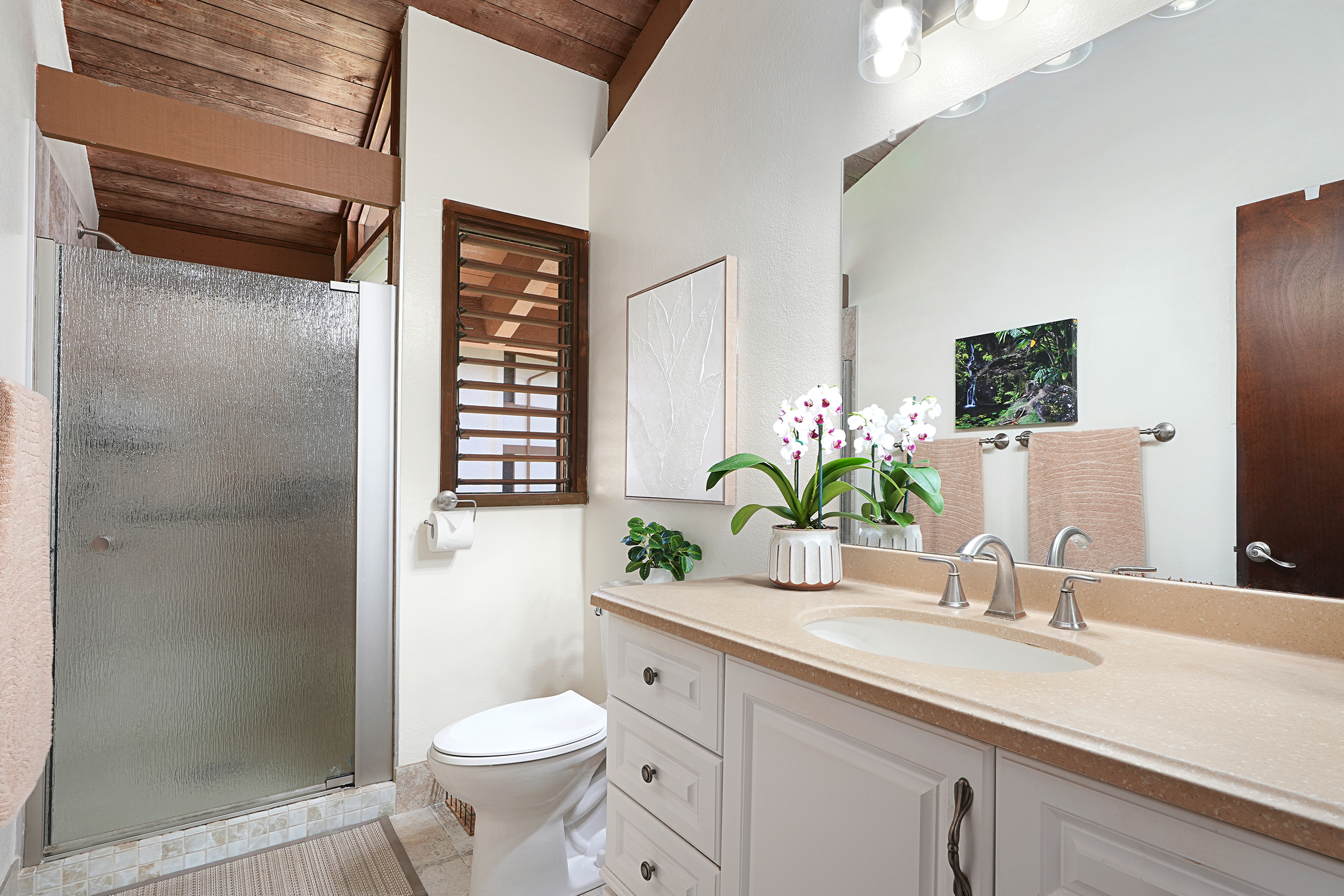 4701 Kawaihau Road, Unit F201 Kapaa, HI 96746 - Photo 11 of 11 a bathroom with a granite countertop toilet sink and shower