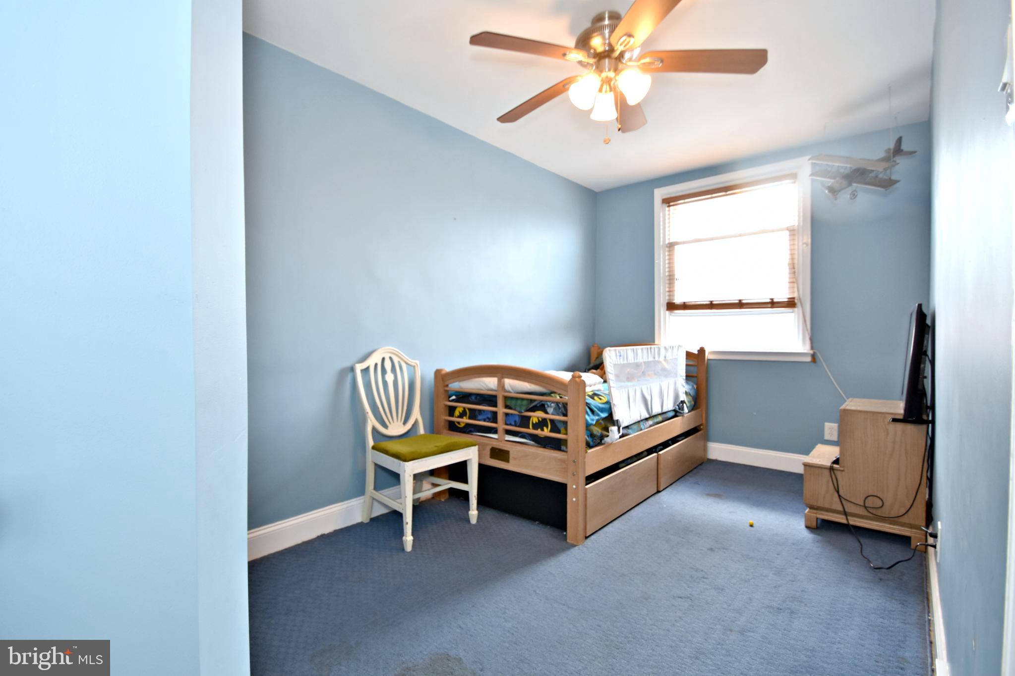 6622 Algard Street Philadelphia, PA 19135 - Photo 16 of 30 a bedroom with furniture and a window