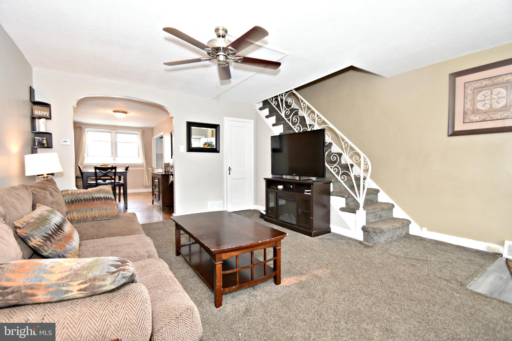 6622 Algard Street Philadelphia, PA 19135 - Photo 3 of 30 a living room with furniture and a flat screen tv