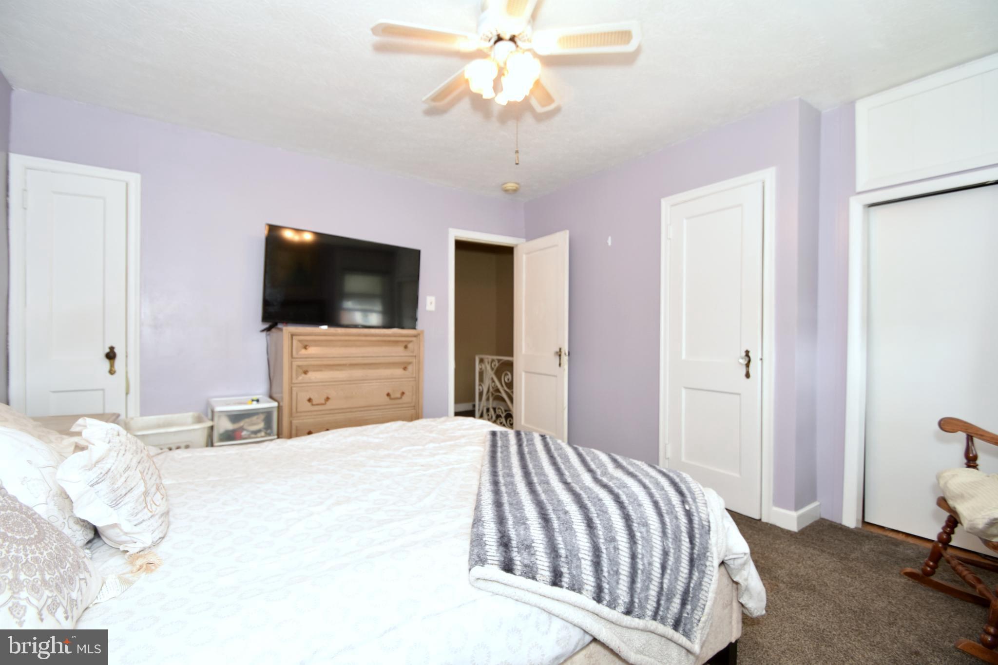 6622 Algard Street Philadelphia, PA 19135 - Photo 23 of 30 a bedroom with a bed and a flat screen tv