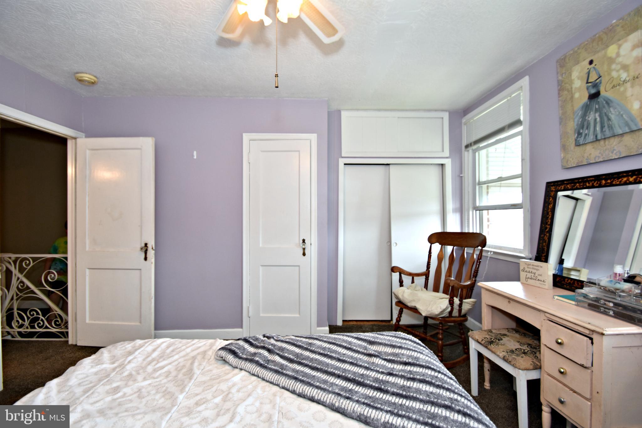 6622 Algard Street Philadelphia, PA 19135 - Photo 24 of 30 a bedroom with a bed and a flat screen tv