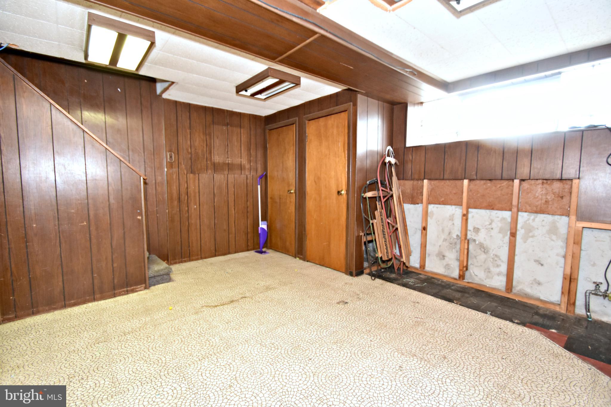 6622 Algard Street Philadelphia, PA 19135 - Photo 25 of 30 a bed room with a balcony a bed and a large window
