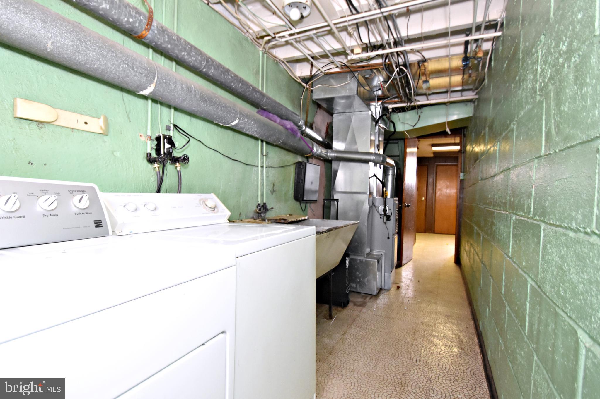 6622 Algard Street Philadelphia, PA 19135 - Photo 27 of 30 a utility room with dryer and washer