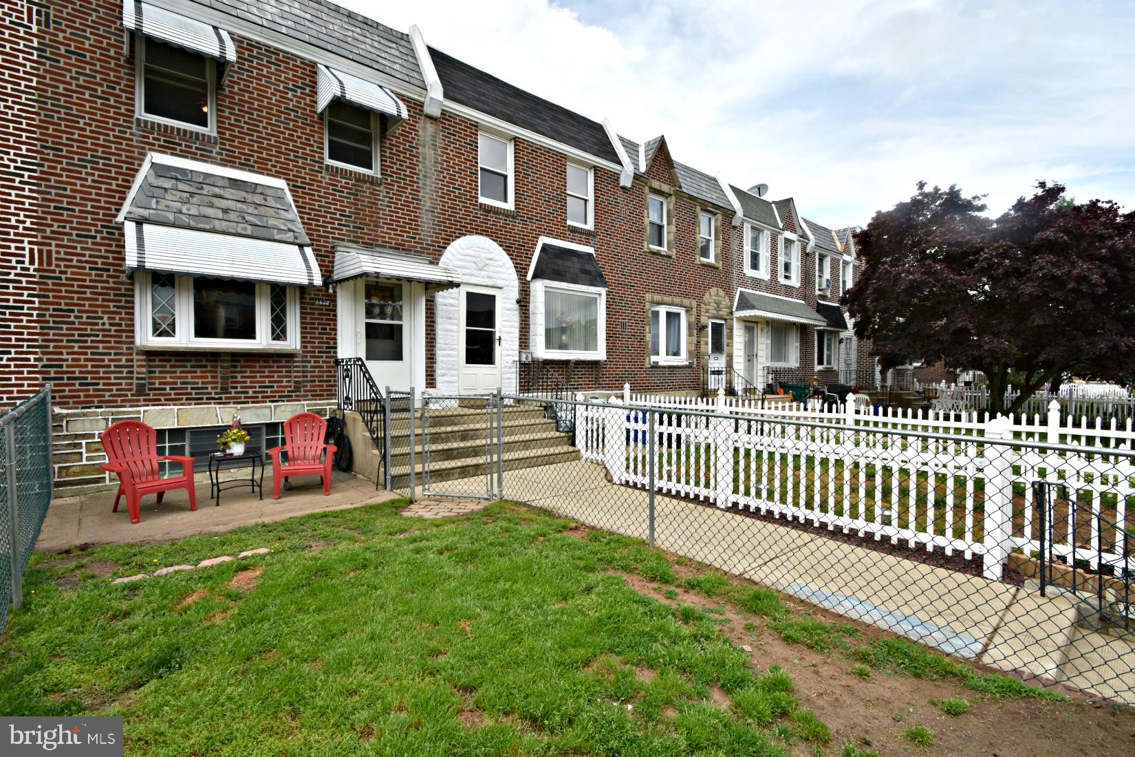 6622 Algard Street Philadelphia, PA 19135 - Photo 30 of 30 a front view of a house with a garden and deck