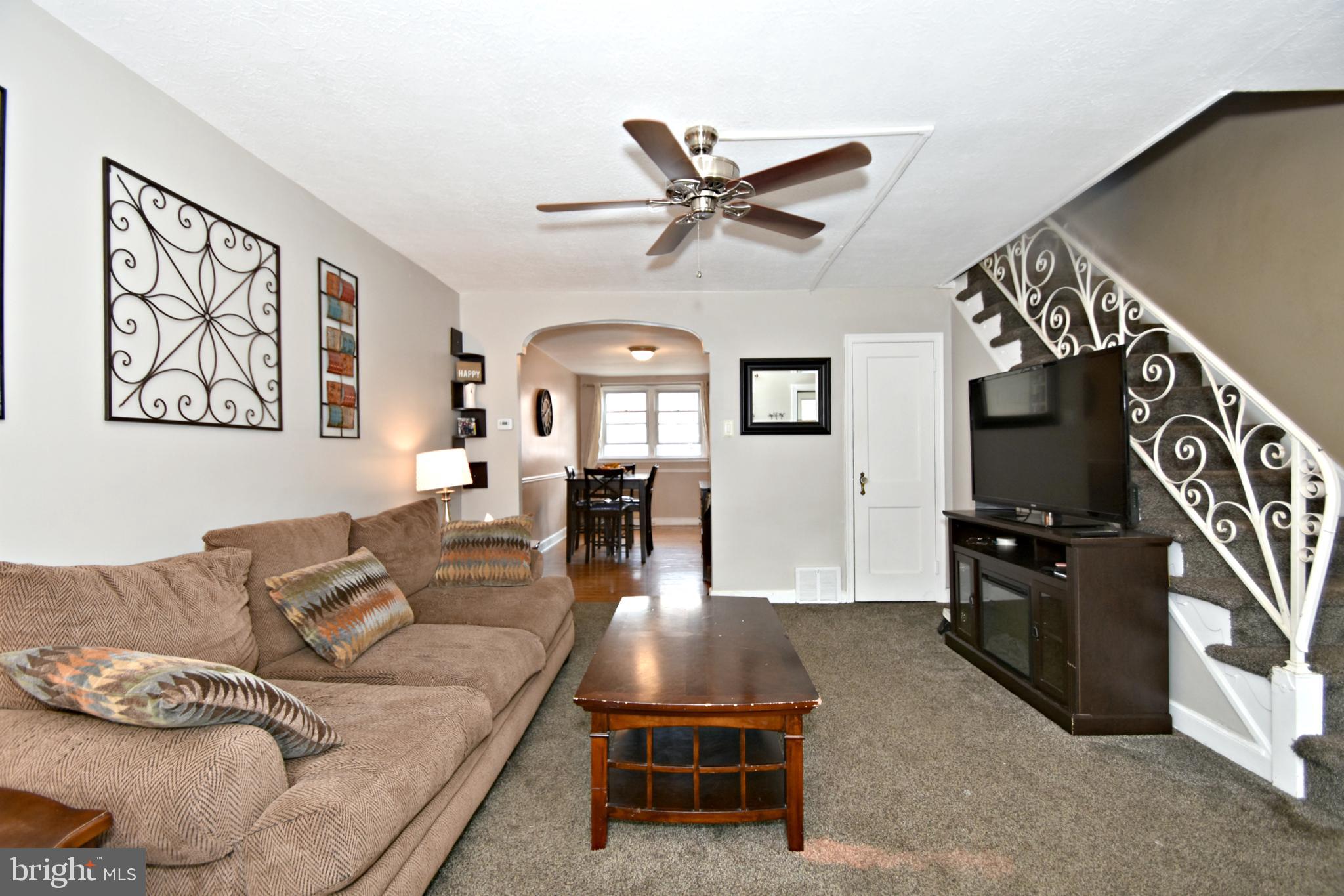 6622 Algard Street Philadelphia, PA 19135 - Photo 5 of 30 a living room with furniture and a flat screen tv