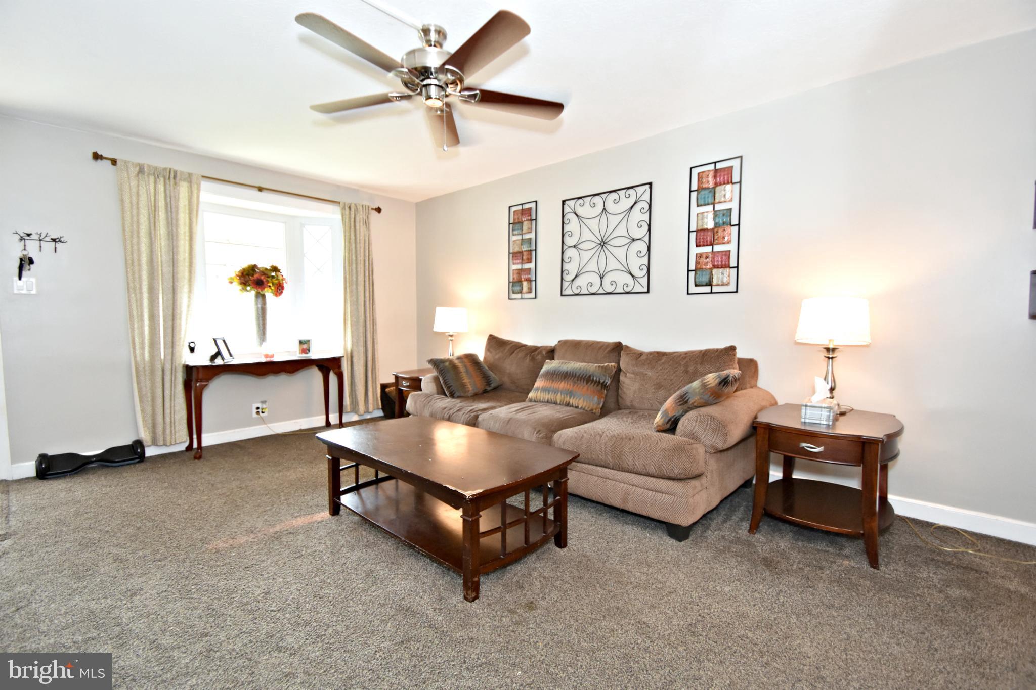 6622 Algard Street Philadelphia, PA 19135 - Photo 6 of 30 a living room with furniture and a window