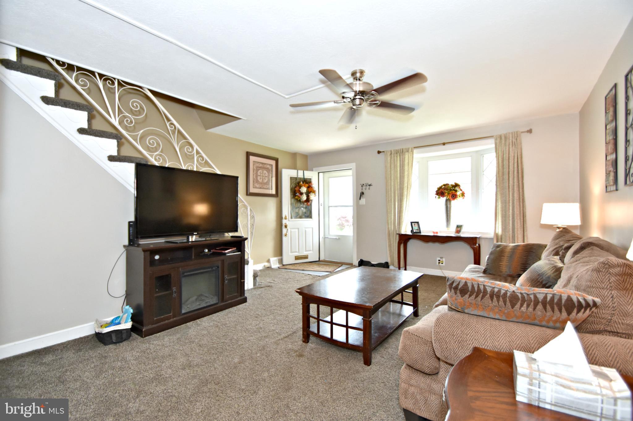 6622 Algard Street Philadelphia, PA 19135 - Photo 7 of 30 a living room with furniture and a flat screen tv