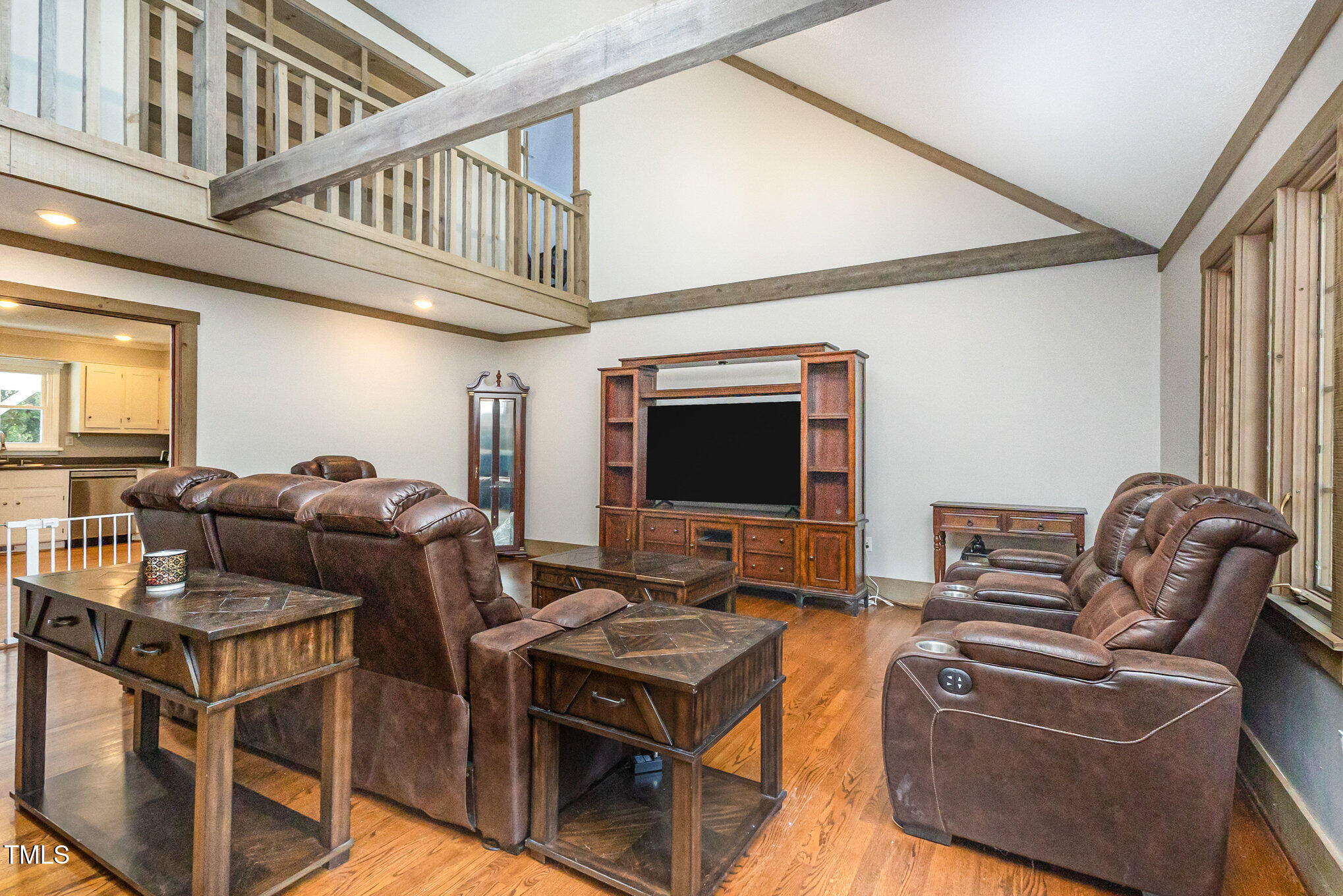 2215 Southern Road Sanford, NC 27330 - Photo 11 of 68 a living room with furniture a flat screen tv and kitchen view
