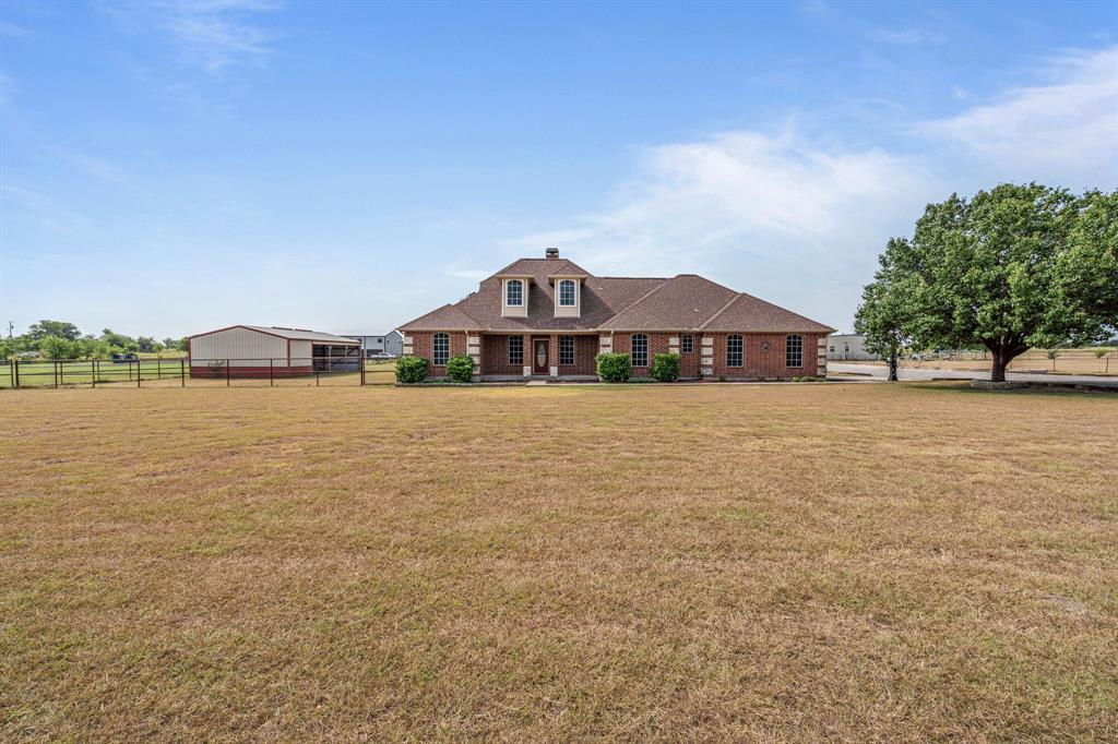 6501 Indian Trail Sanger, TX 76266 - Photo 2 of 40 View of front facade featuring a chimney and covered porch