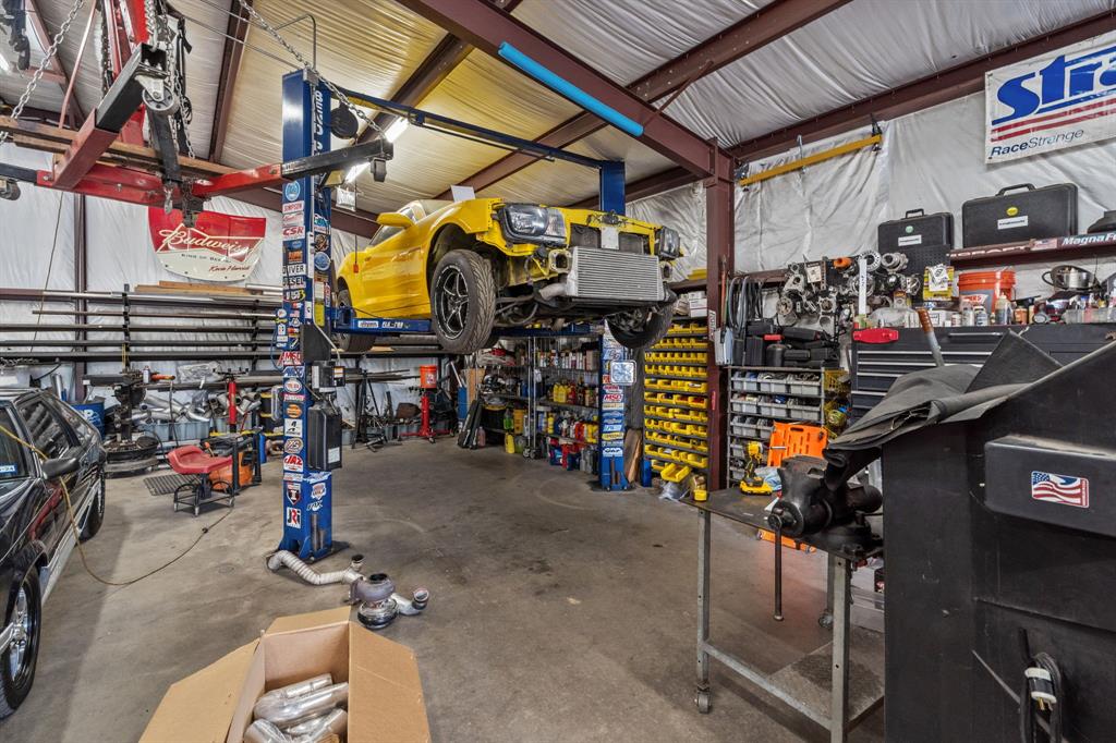 6501 Indian Trail Sanger, TX 76266 - Photo 40 of 40 Garage with a workshop area and metal wall