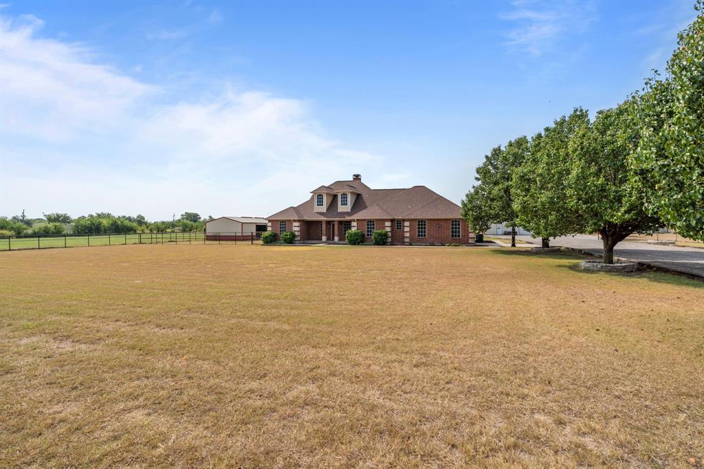 6501 Indian Trail Sanger, TX 76266 - Photo 4 of 40 View of front facade featuring a chimney and a view of countryside