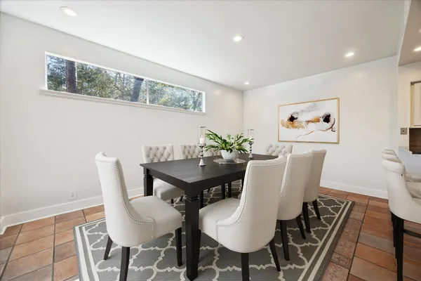 a large kitchen with stainless steel appliances granite countertop a sink and cabinets