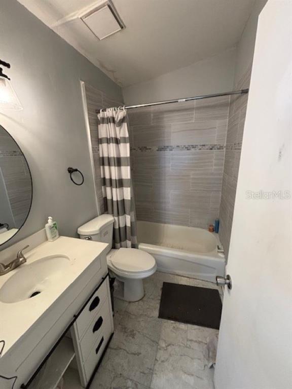 203 Northwest 25 Street Gainesville, FL 32607 - Photo 6 of 11 a bathroom with a sink a toilet and shower