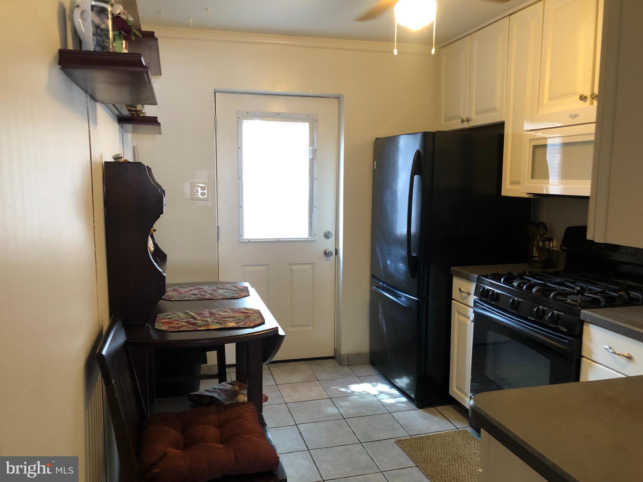 12412 Barbary Road Philadelphia, PA 19154 - Photo 14 of 32 Unit 1 kitchen. Door opens to deck.