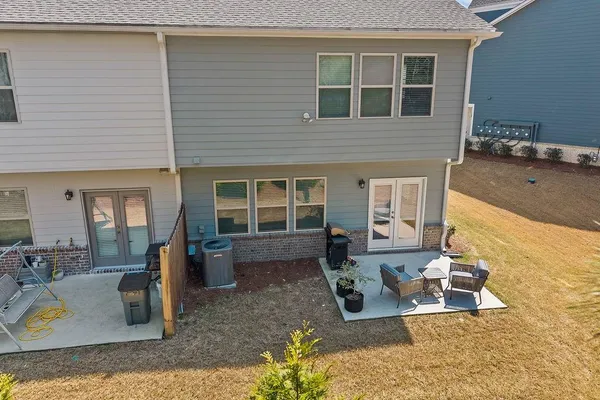 a front view of a house with outdoor seating