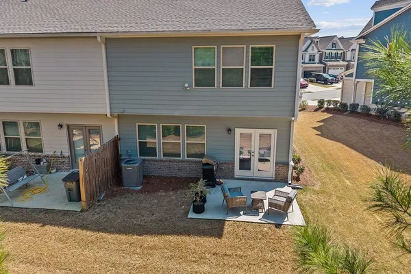 a view of a house with a backyard