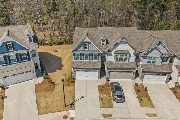 a view of a house with backyard and deck