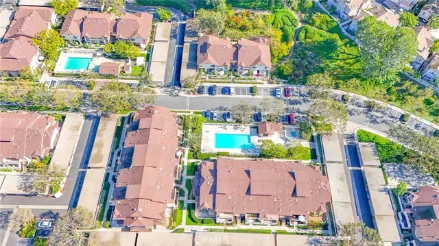 an aerial view of a houses with outdoor space