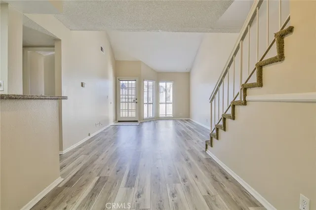 a view of entryway with wooden floor