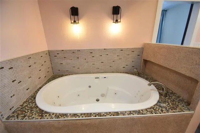 a bathroom with a bathtub and a sink
