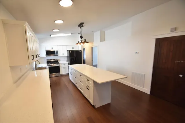 a workspace with furniture and wooden floor