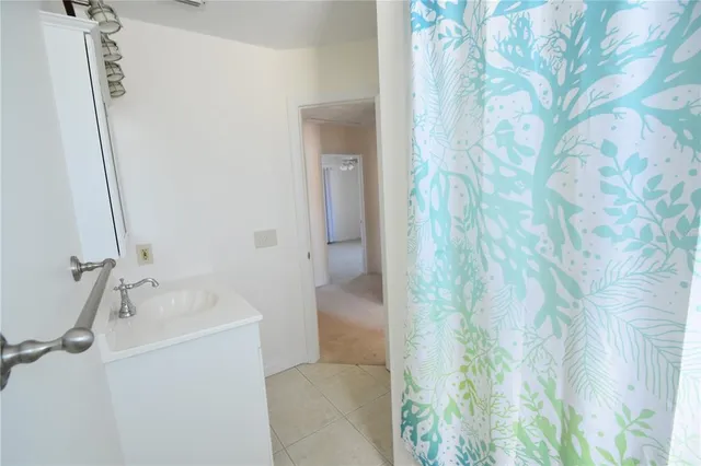 a view of a backyard with swimming pool