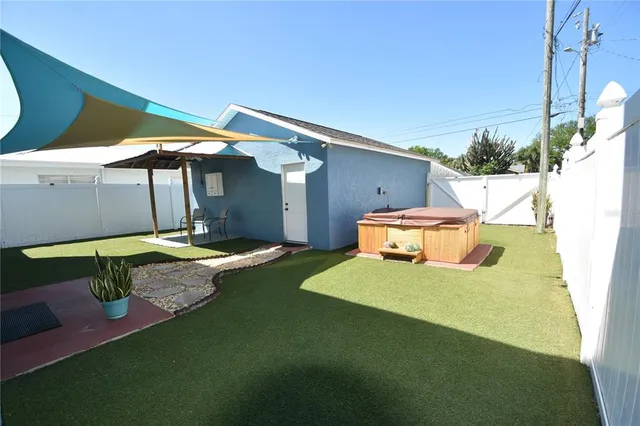 a view of back yard of the house