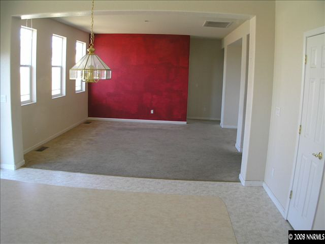 8999 Wynne Street Reno, NV 89506 - Photo 3 of 3 an empty room with windows