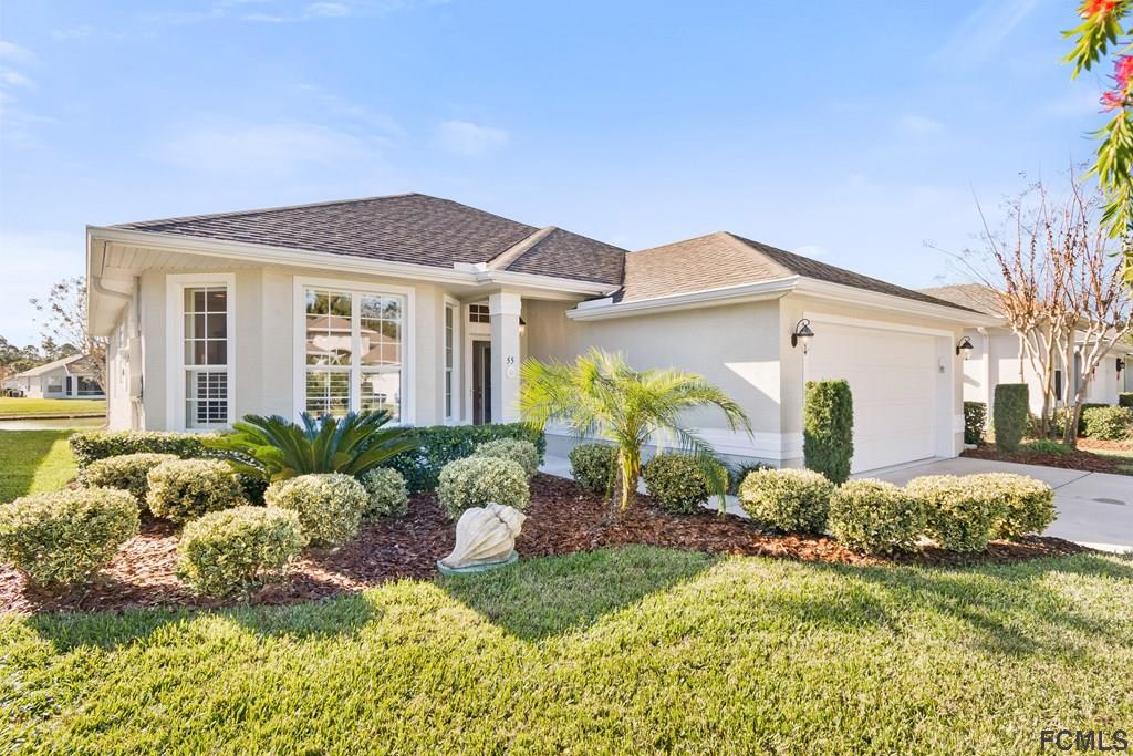 55 Raintree Circle Palm Coast, FL 32164 - Photo 2 of 62 Beautifully maintained landscaping