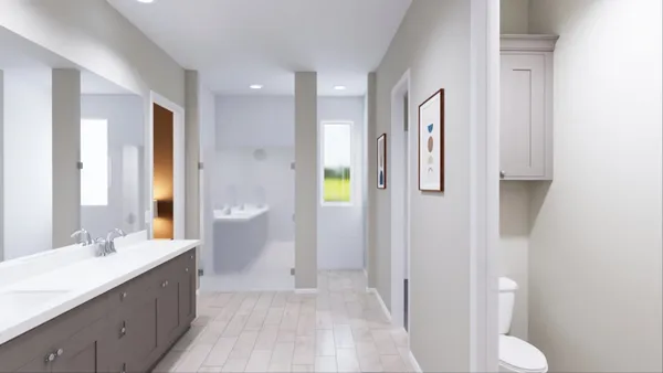 a spacious bathroom with a double vanity sink and a mirror