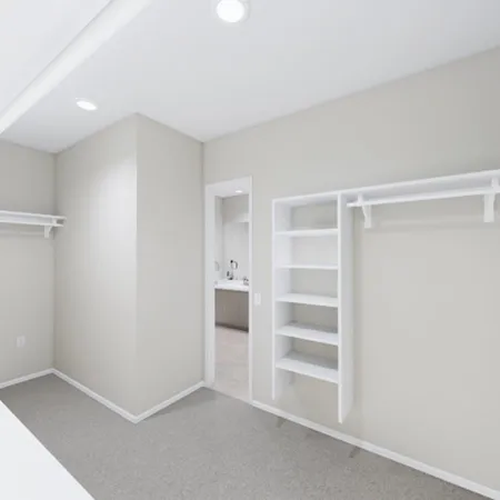a view of an empty room with a closet