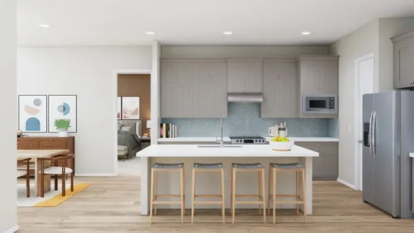 a kitchen with a table chairs refrigerator and cabinets