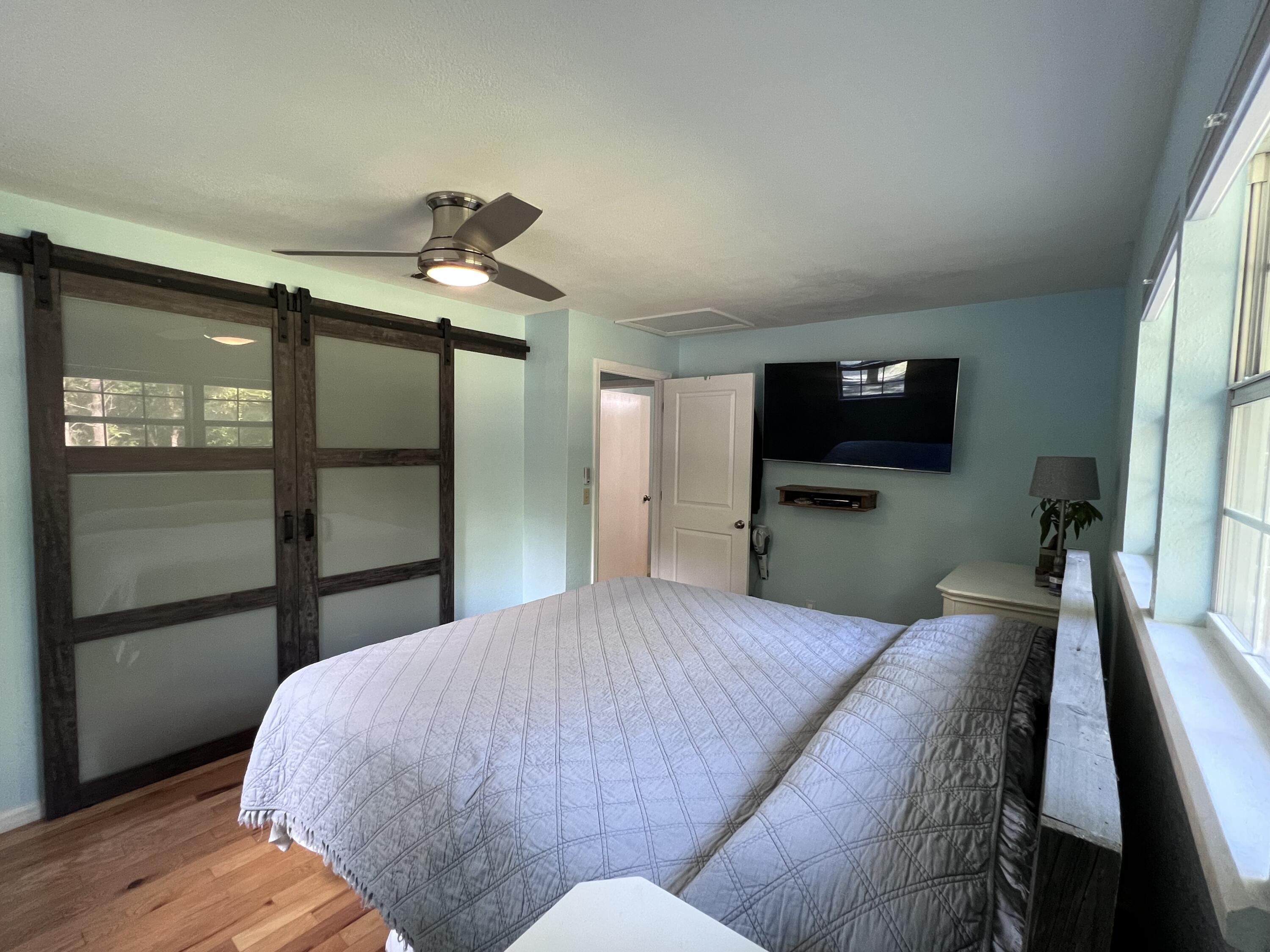 Xxxx Kervin Road Crestview, FL 32539 - Photo 43 of 78 a bedroom with a bed and a flat screen tv