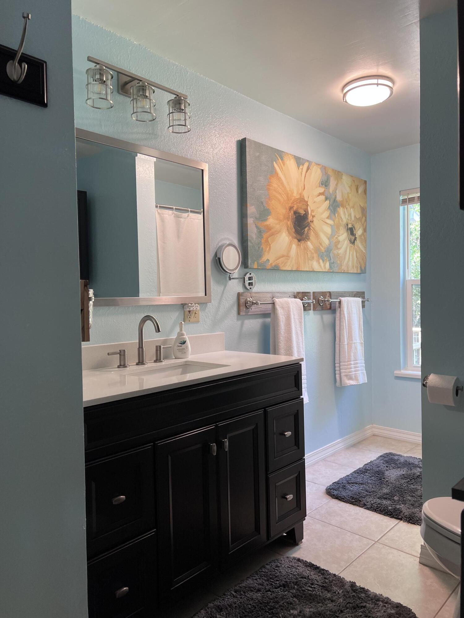 Xxxx Kervin Road Crestview, FL 32539 - Photo 44 of 78 a bathroom with a double vanity sink and a mirror