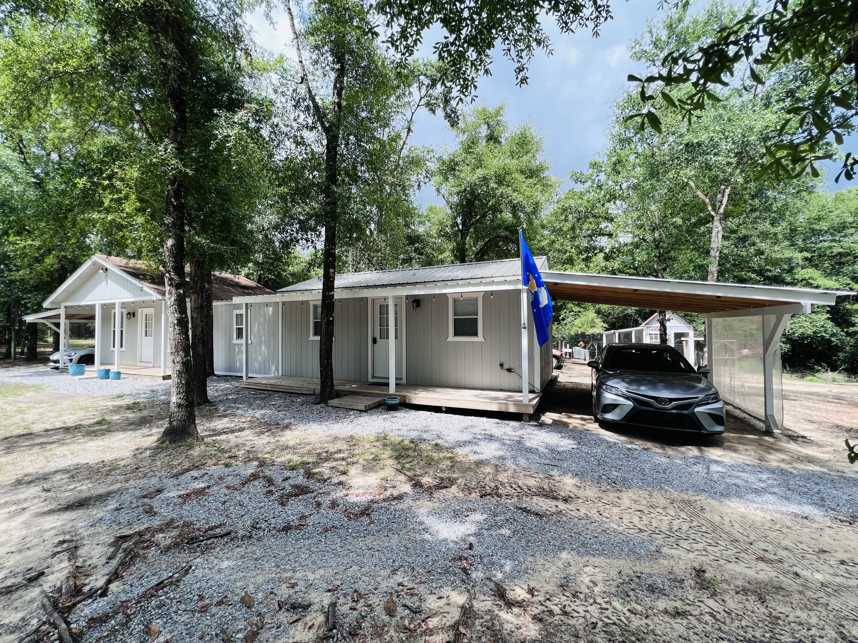 Xxxx Kervin Road Crestview, FL 32539 - Photo 68 of 78 a view of a house with backyard space and wooden fence