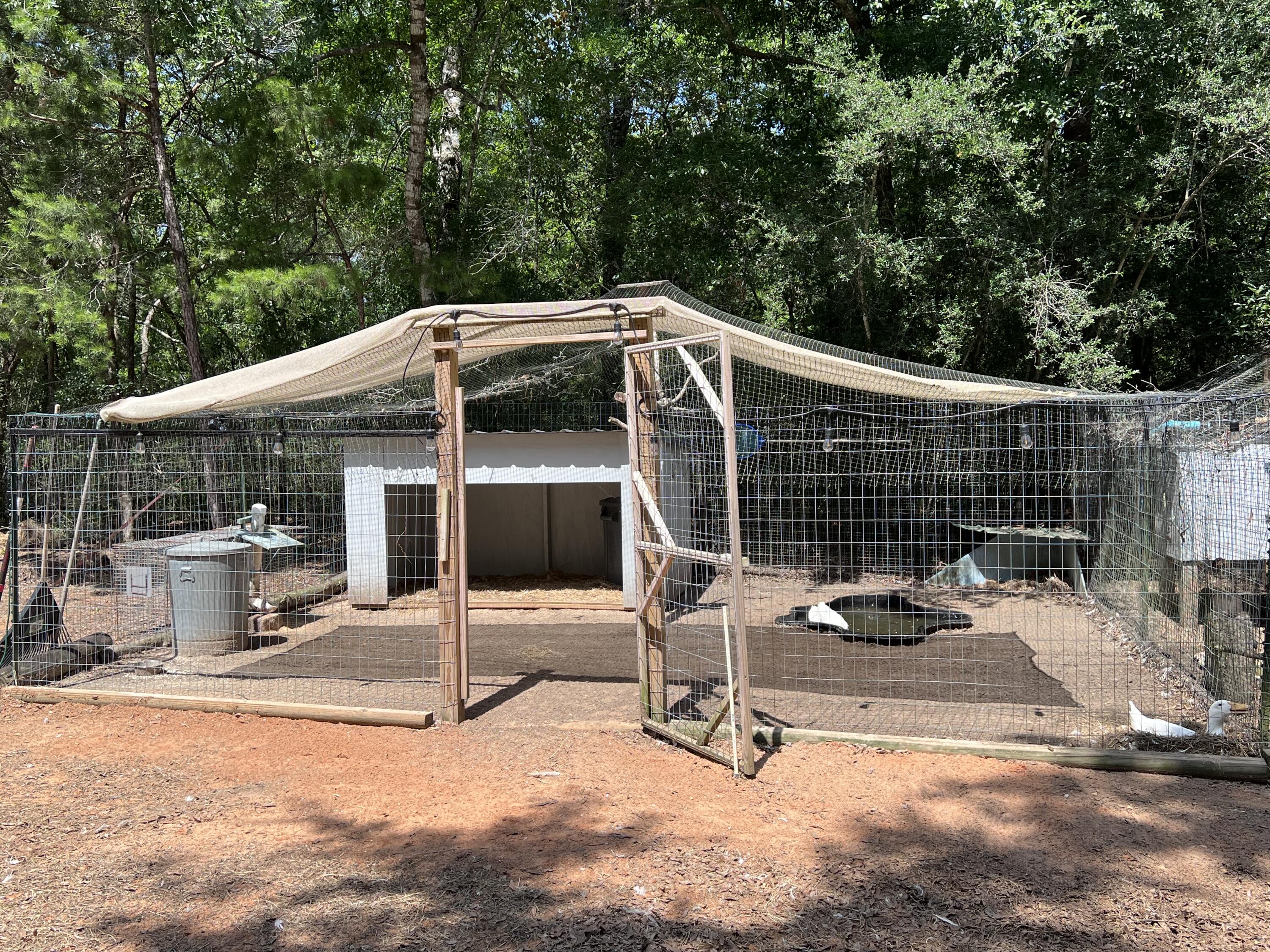Xxxx Kervin Road Crestview, FL 32539 - Photo 77 of 78 a view of a patio with a table and chairs and potted plants