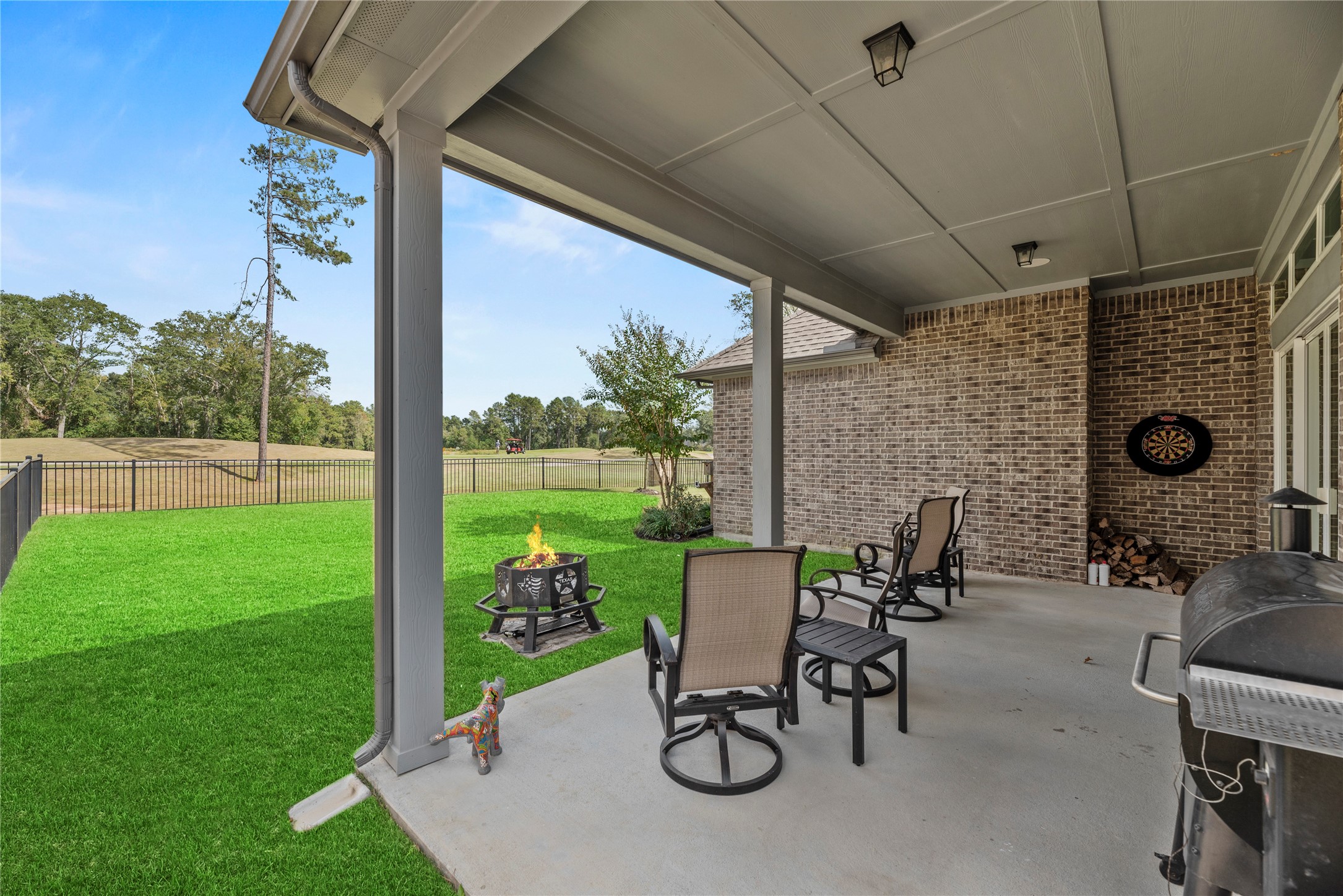 7543 Congress Trail Way Porter, TX 77365 - Photo 13 of 45 a view of a porch with chairs and backyard