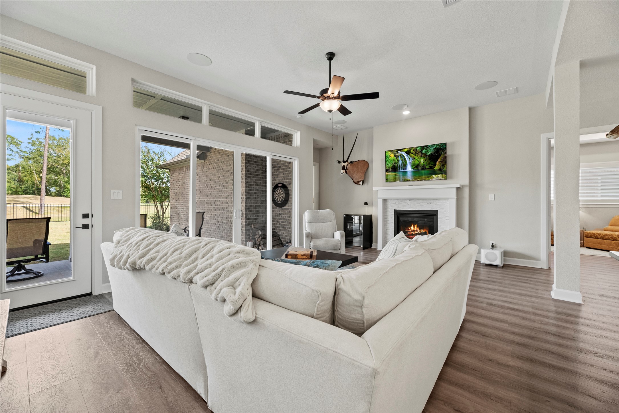7543 Congress Trail Way Porter, TX 77365 - Photo 19 of 45 a living room with furniture fireplace and a flat screen tv