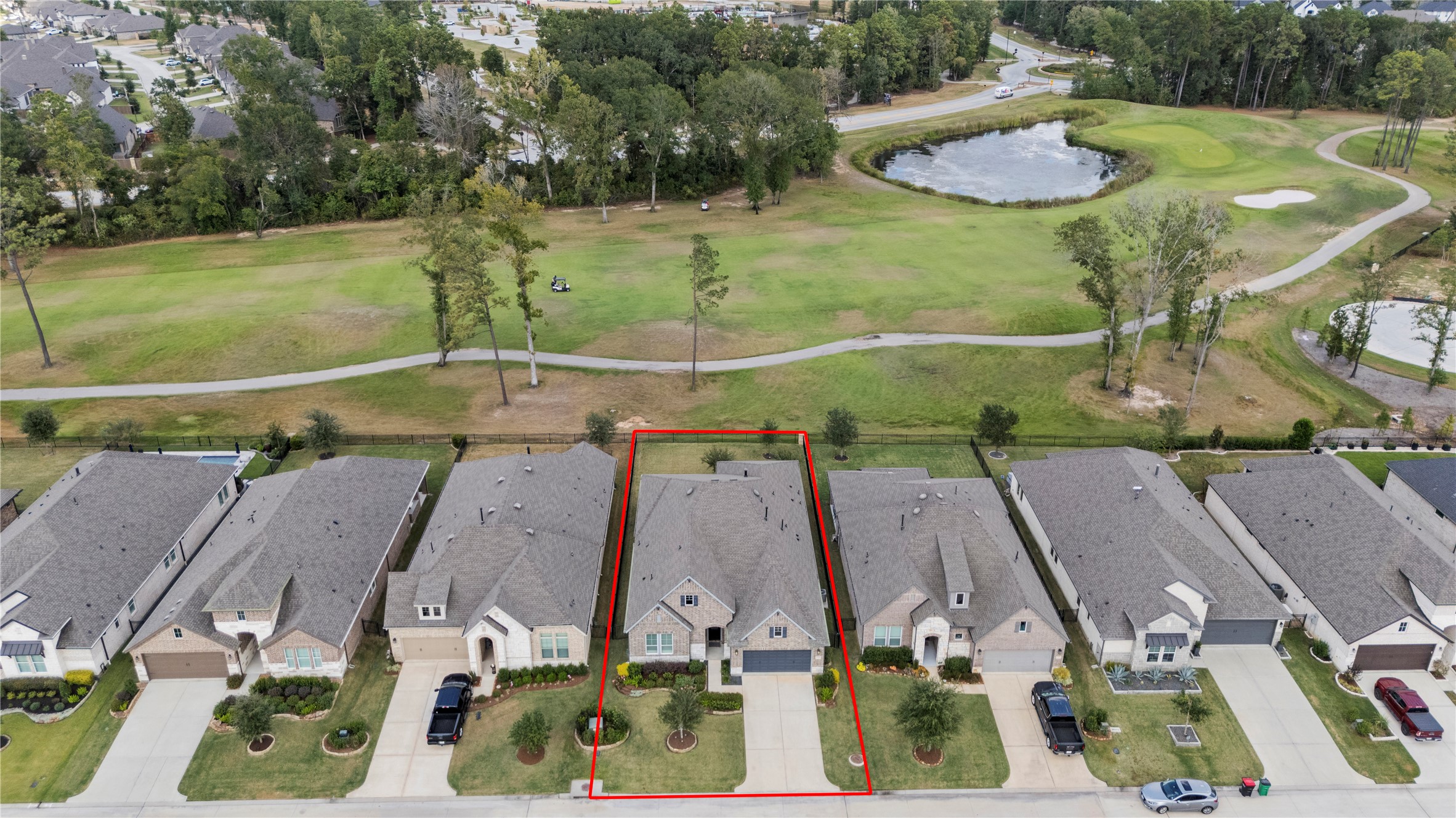 7543 Congress Trail Way Porter, TX 77365 - Photo 2 of 45 an aerial view of residential houses with outdoor space and a swimming pool