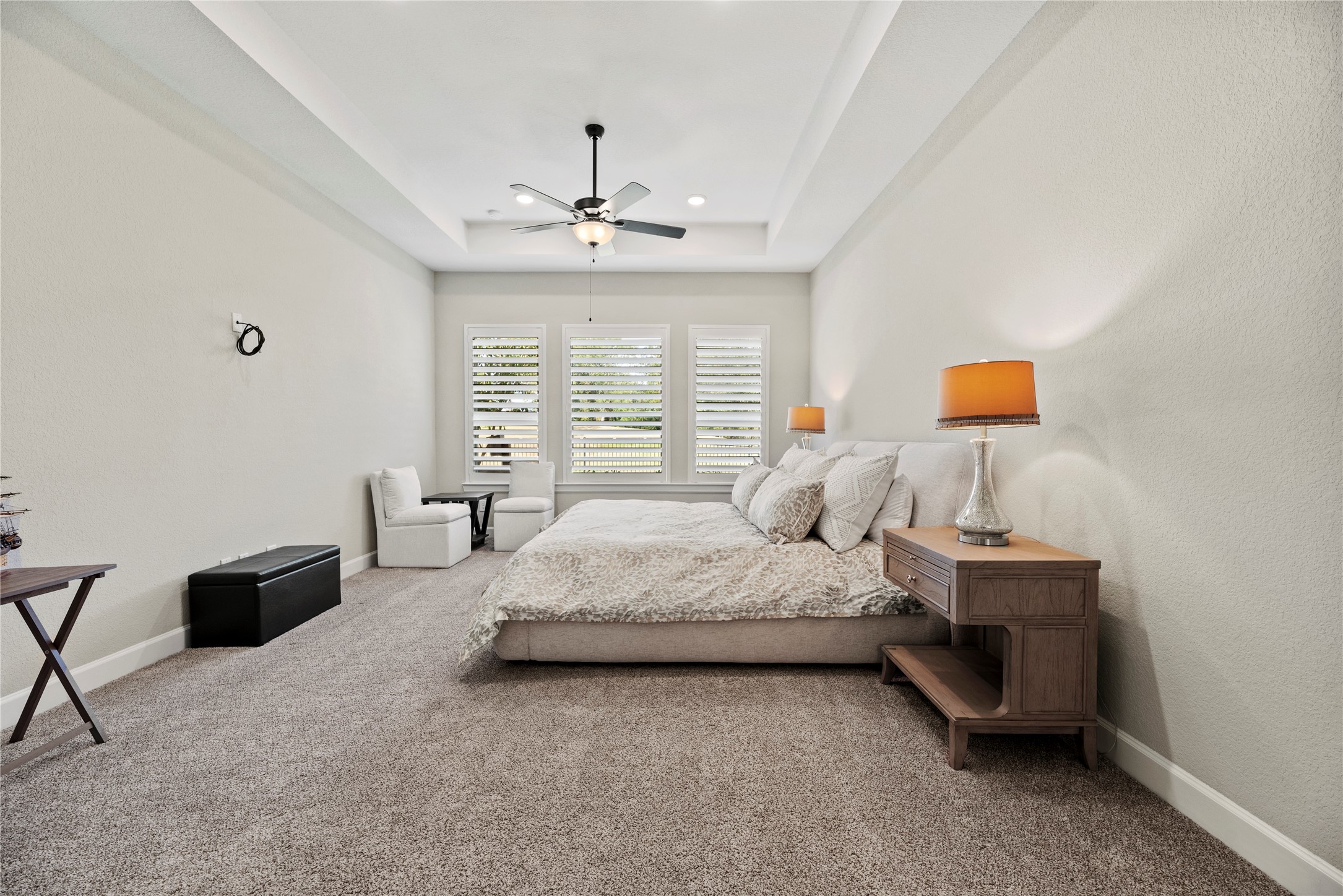 7543 Congress Trail Way Porter, TX 77365 - Photo 21 of 45 a spacious bedroom with a bed couch and window