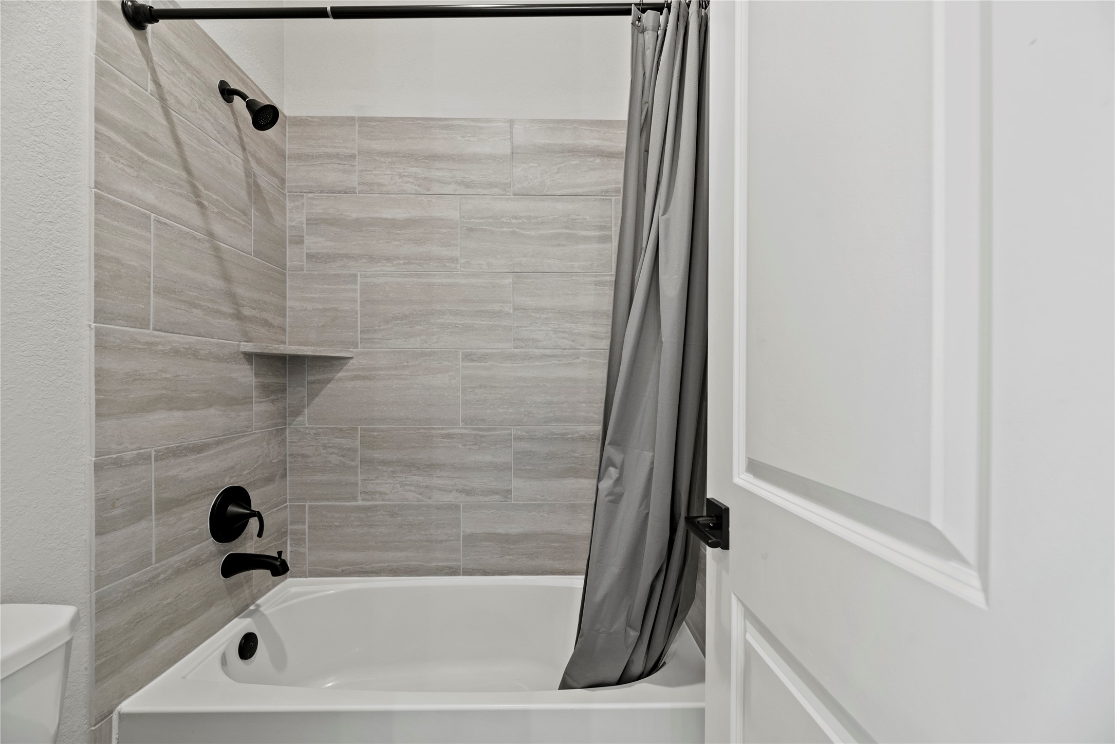 7543 Congress Trail Way Porter, TX 77365 - Photo 30 of 45 a bathroom with a tub