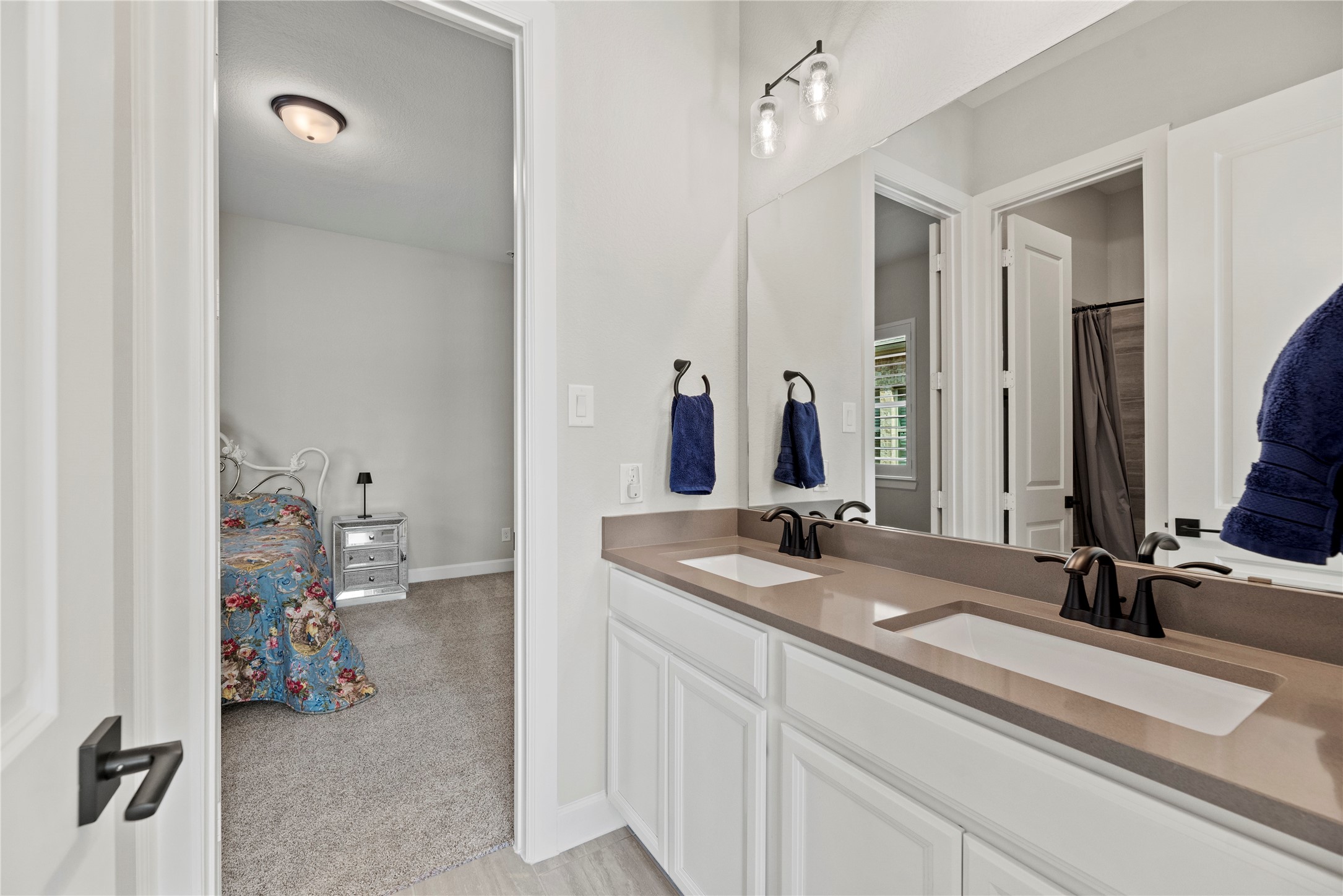 7543 Congress Trail Way Porter, TX 77365 - Photo 31 of 45 a bathroom with a sink and a mirror