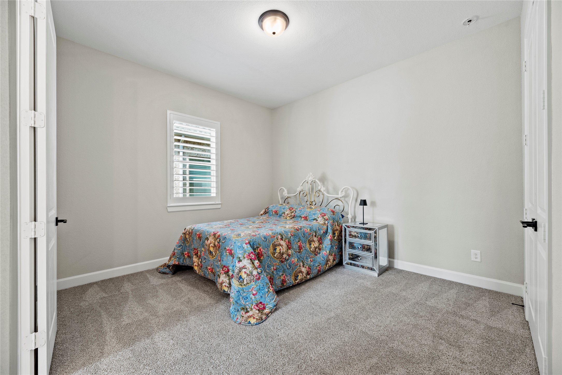 7543 Congress Trail Way Porter, TX 77365 - Photo 32 of 45 a room with a bed and a window