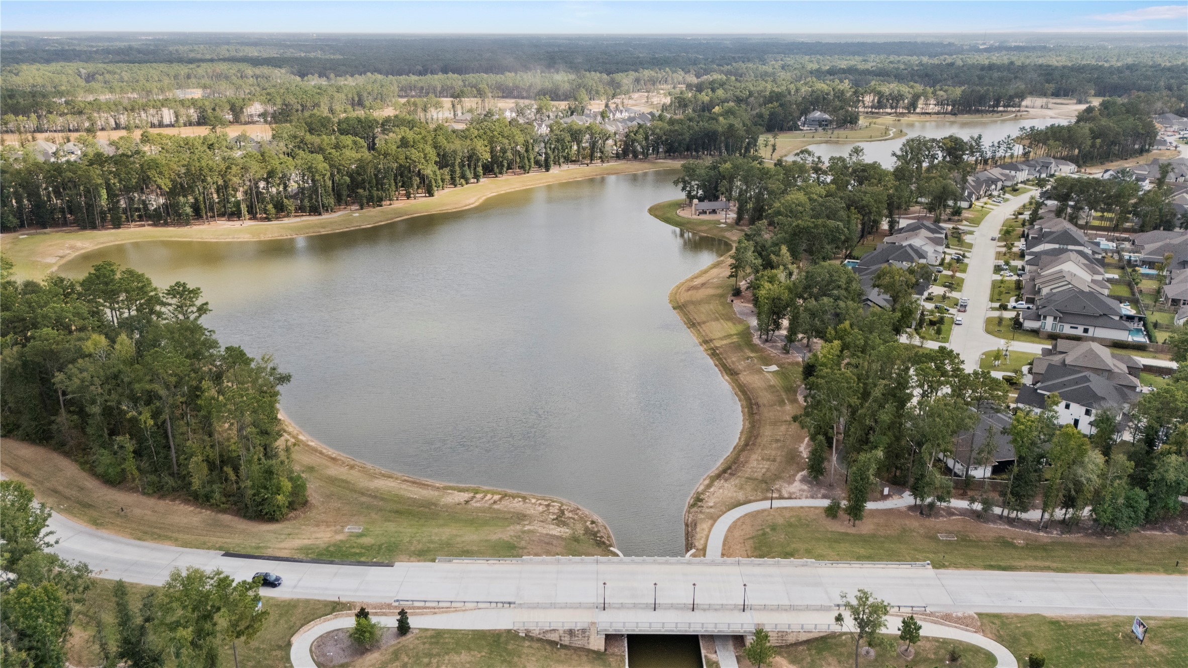 7543 Congress Trail Way Porter, TX 77365 - Photo 37 of 45 an aerial view of a house with a yard and lake view