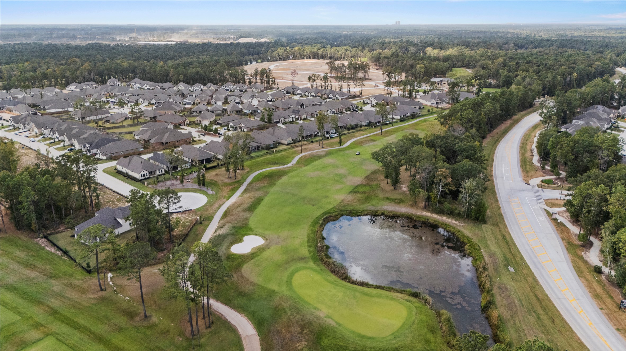 7543 Congress Trail Way Porter, TX 77365 - Photo 42 of 45 an aerial view of residential houses with outdoor space and pool