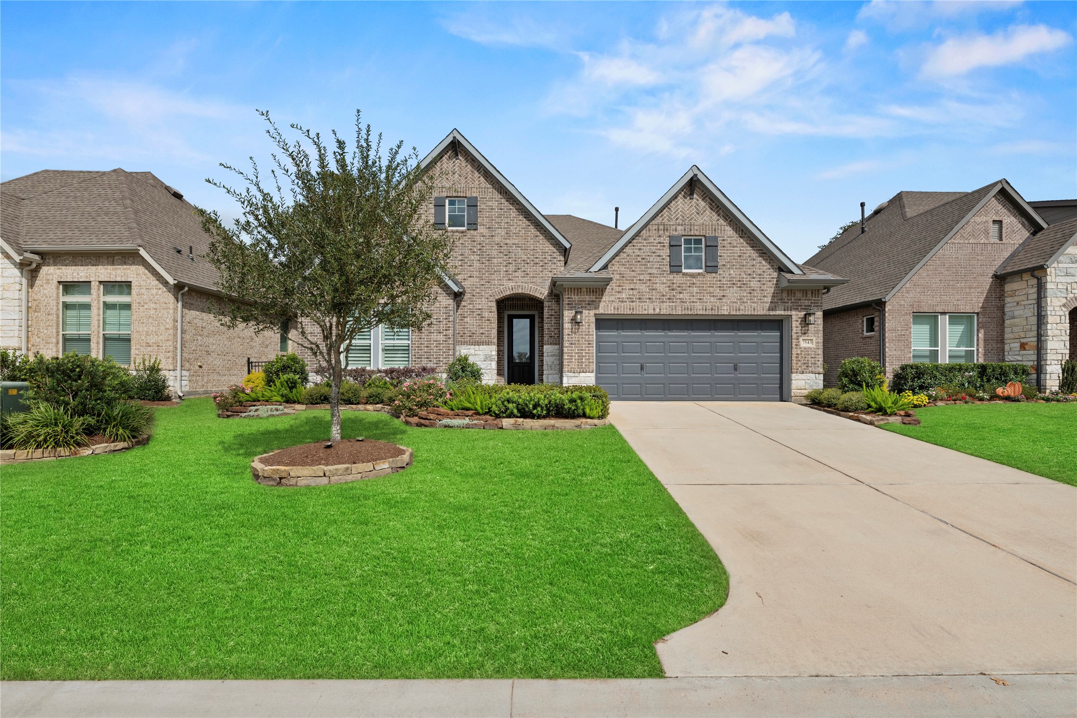 7543 Congress Trail Way Porter, TX 77365 - Photo 45 of 45 a front view of a house with a yard and garage