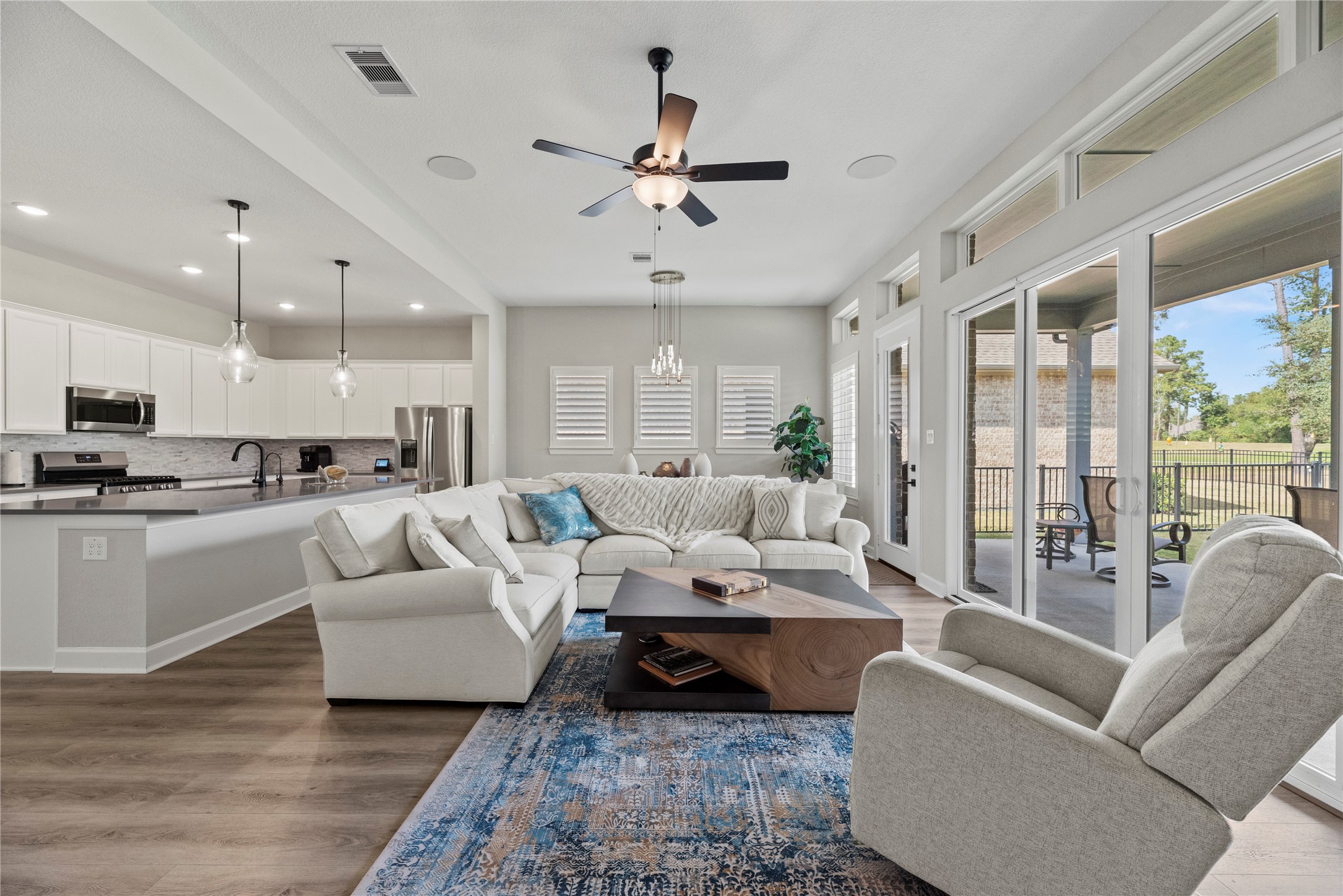 7543 Congress Trail Way Porter, TX 77365 - Photo 10 of 45 a living room with furniture ceiling fan and a large window