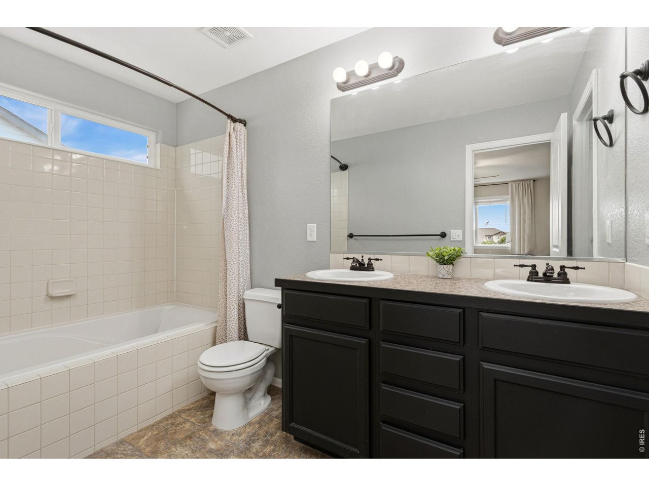 6837 McClellan Road Wellington, CO 80549 - Photo 15 of 23 The ensuite with double vanities and a large soaking tub will not disappoint.