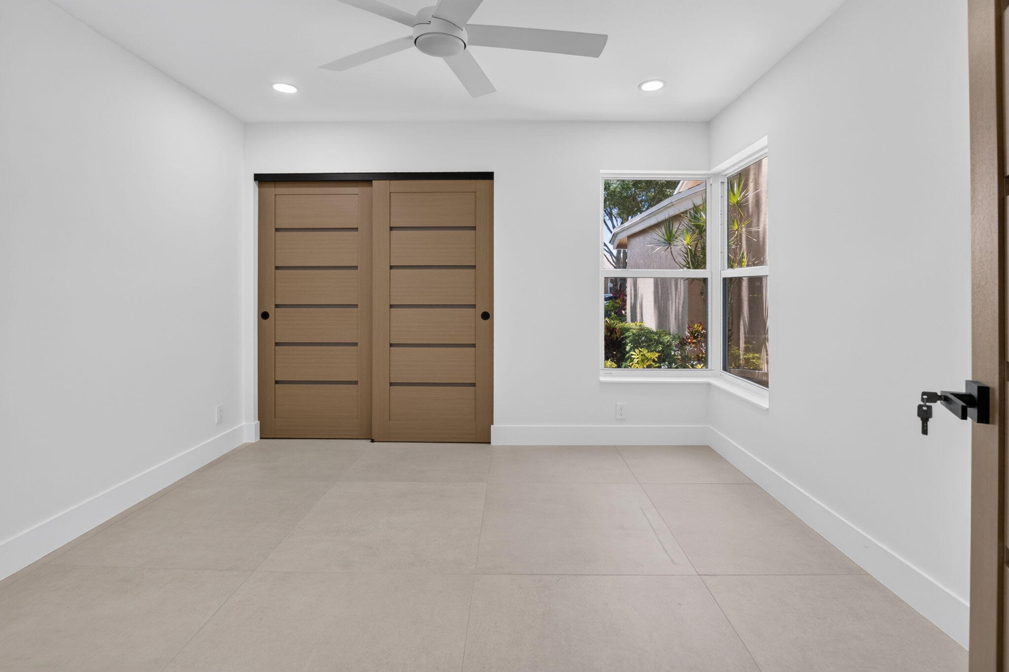 8306 Summersong Terrace Boca Raton, FL 33496 - Photo 38 of 51 an empty room with windows