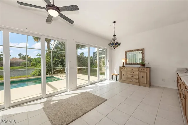 a living room with furniture a window and a chandelier
